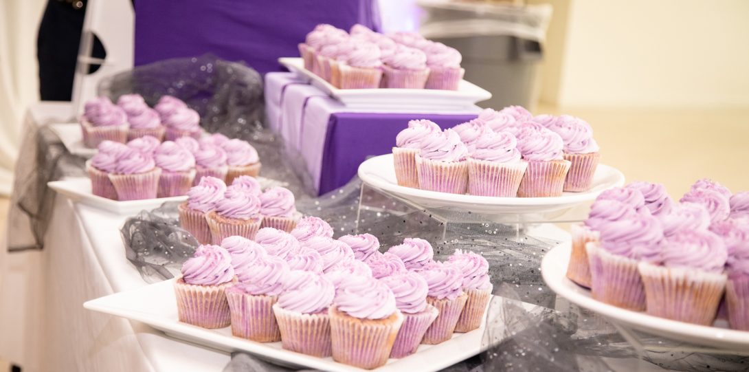 Purple cupcakes on trays during the LavGrad ceremony.