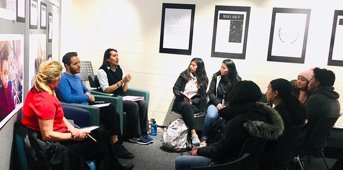 GSC Staff members Antonio Santos (Blue shirt) and Moisés Villada (Black vest and white dress shirt) engaging with a class in our Flex Space.