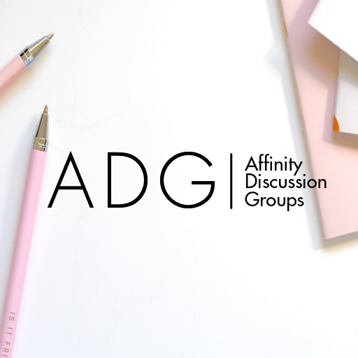 Top down picture of a white desk with two pink pencils on the left side and three pink, orange, and white notebooks on the right side. In the center is the Affinity Discussion Group (ADG) logo.