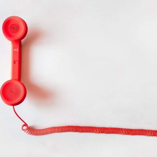 Photograph of a red phone.