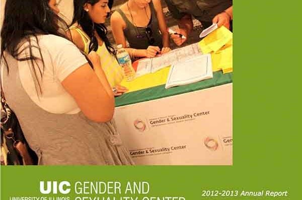 Cover of annual report 2012-13 with green border and students on a table